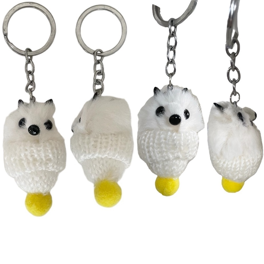 White Animal Keychain with Yellow Pom Pom in Mini Knitted Hat